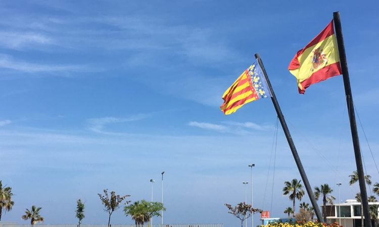 Sky with two flagpoles and flags